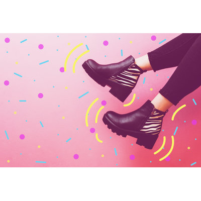 Ebern Designs Two Women's Legs Dangle In Fashionable Boots On Canvas by Katya_Havok Graphic Art